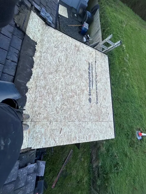 New boards laid over a flat roof, ready for the covering. One of our jobs.