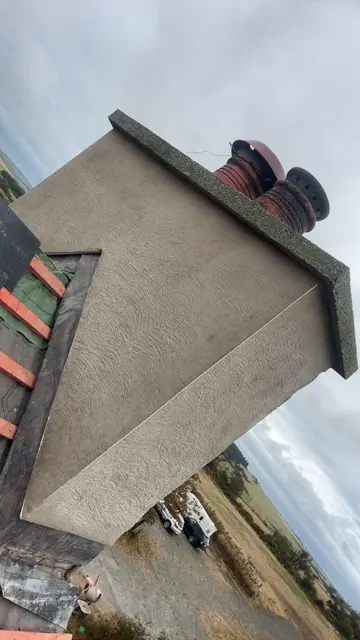 Rendered chimney stack with clay pots. One of our jobs.
